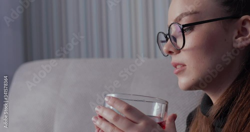 girl drinks warm tea. stay at home. isolation at home. closeup.