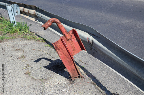 Tableau sur toile Damaged guard rail next to the road