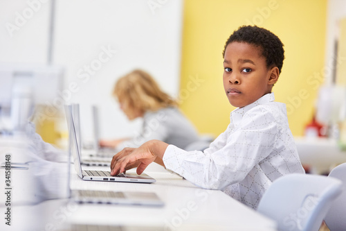 African boy at the laptop computer