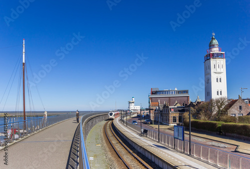 Railroad track and lighthouse in the harbor of Harlingen, Netherlands