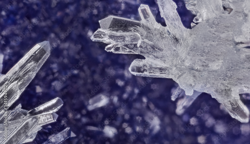 Fototapeta premium white crystals on dark blue background
