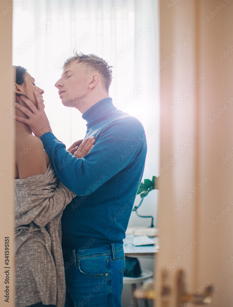 Couple in love. Love photo. Man and woman room. Kissing. Sexy photo. Sensual. 