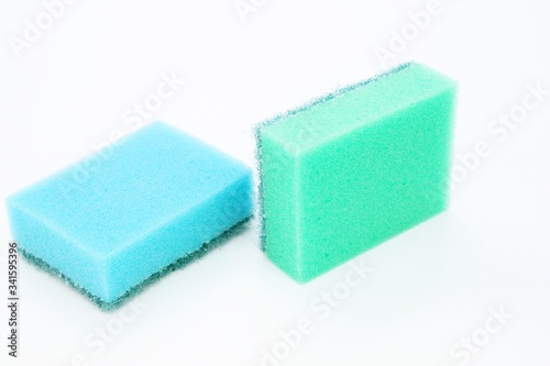 Sponges for washing dishes located on a white background