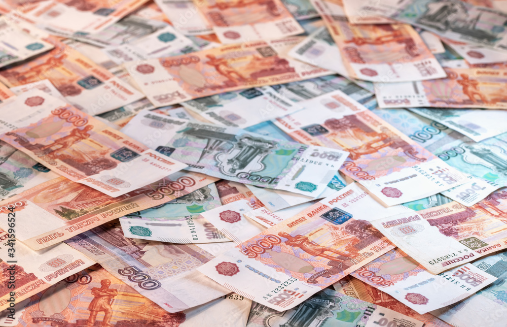 Background of banknotes of five and one thousand Russian rubles Background of banknotes of five and one thousand Russian rubles