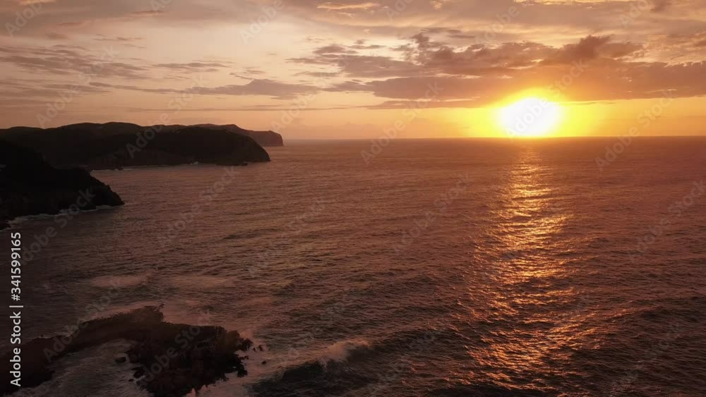 Aerial view of an epic sunset on the north coast of Ibiza at the goldenhour after a massive storm Aerial view of an epic sunset on the north coast of Ibiza at the goldenhour after a massive storm