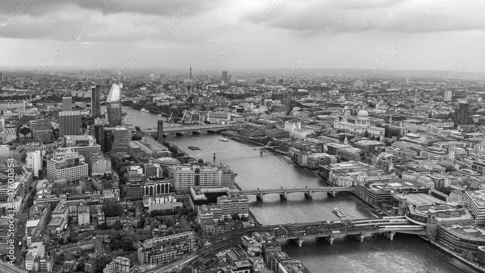 Φωτογραφία Aerial view over the City of London and River Thames in black and white, England