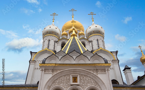 Zachatyevsky Monastery Katholikon in Ostozhenka district, Moscow, Russia. Nativity of Virgin Mary Cathedral. Orthodox church and blue cloudy sky.  photo