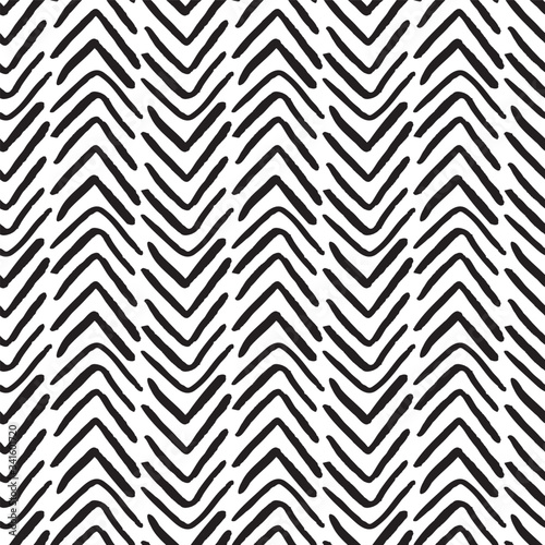 Black and white grunge herringbone vector seamless pattern. Abstract hand drawn doodles background with chevrons for fabric, wallpaper, invitation cards or scrapbooking projects.
