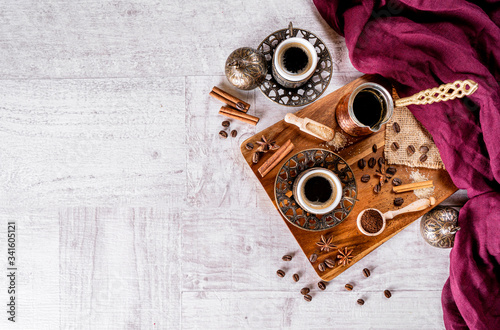 Turkish coffee cup concept on a plain white wood background