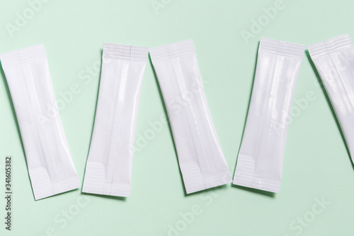 Set of white disposable packaging for snacks, food, sugar and spices. Sachets for medicines
