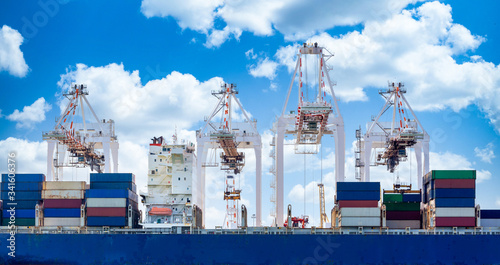 Harbor cargo cranes shipping port equipment, Industrial port crane, Logistics business huge cranes and containers, Cargo freight ship with industrial crane, Container ship in import export business.