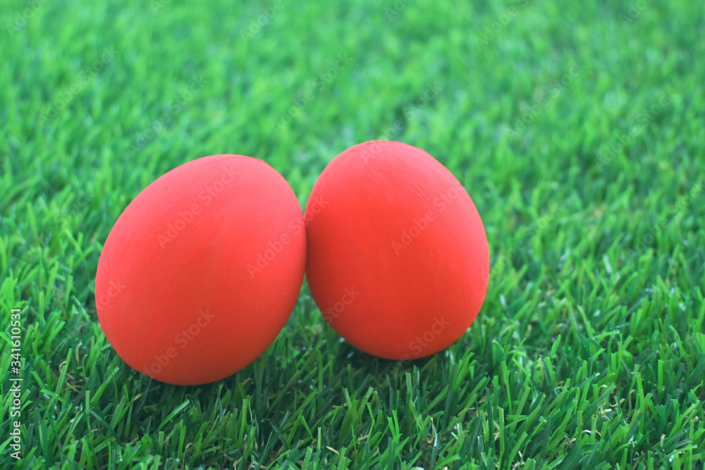 red easter egg on lawn green grass artificial, image of morning springtime concept