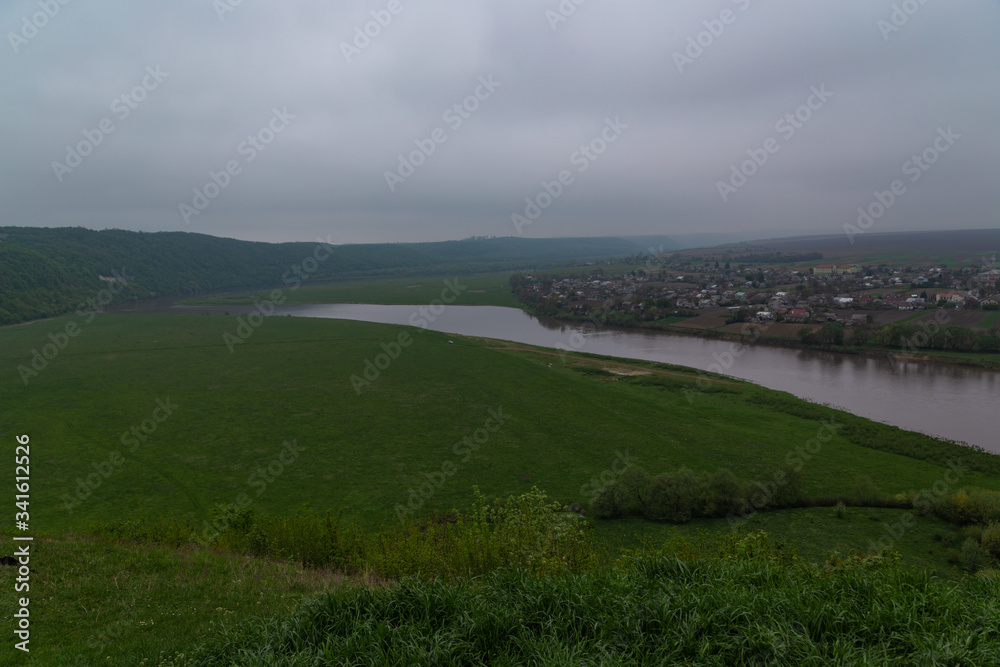 panorama view of the Dniester River in cloudy weather in early spring