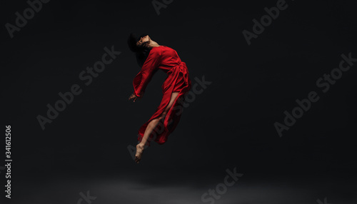 Photographie Contemporary dancer dancing on studio background