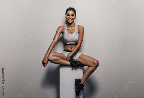Fototapeta Naklejka Na Ścianę i Meble -  Fit woman relaxing after exercising