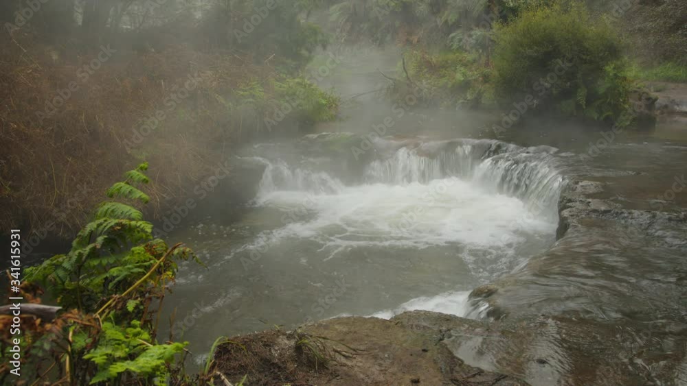 Natural Hot Spring Waterfall - Kerosene Creek near Waiotapu, New Zealand // Static Wide Shot