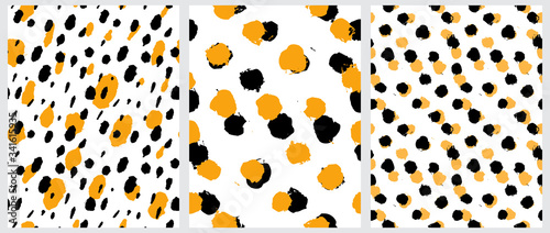 Simple Freehand Spots Seamless Vector Patterns. Warm Yellow and Black Hand Drawn Brush Dots Isolated on a  White Background. Rough Irregular Geometric Print for Fabric, Textile. 