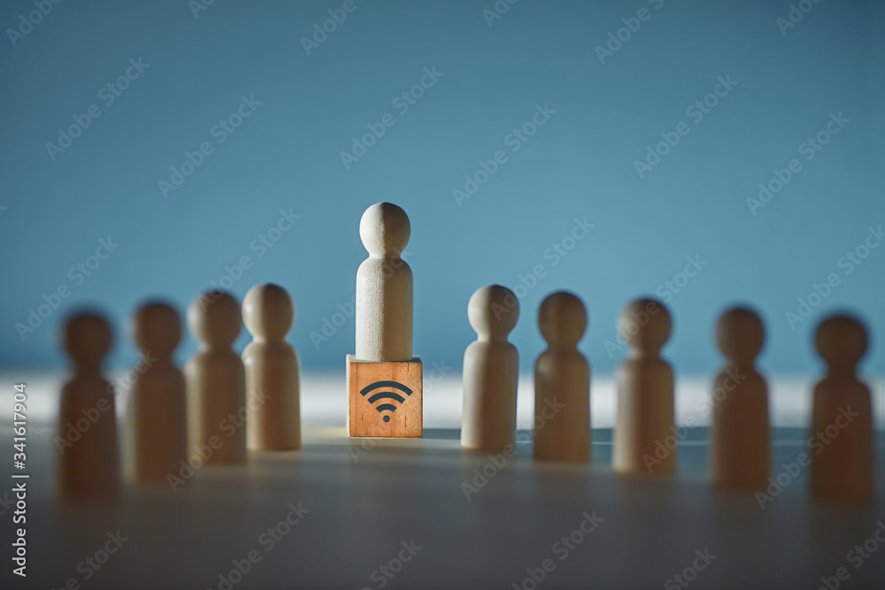 Customer support service. Call centre. Round-the-clock help. Wooden figures, operator on cube, wifi sign, copy space Customer support service. Call centre. Round-the-clock help. Wooden figures, operator on cube, wifi sign, copy space