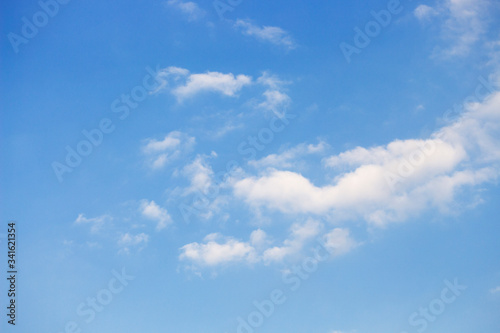 Bright blue sky with white clouds for background or wallpapers