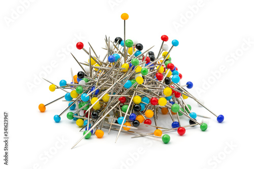 Heap of multi colored sharp sewing pins