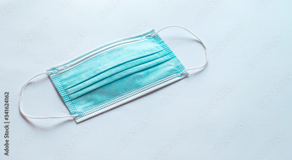 Blue medical mask isolated on plain background Blue medical mask isolated on plain background