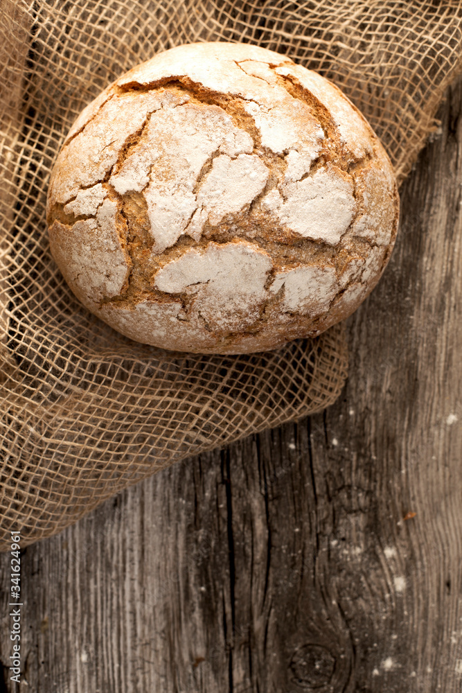 homemade fresh bread on a wooden table