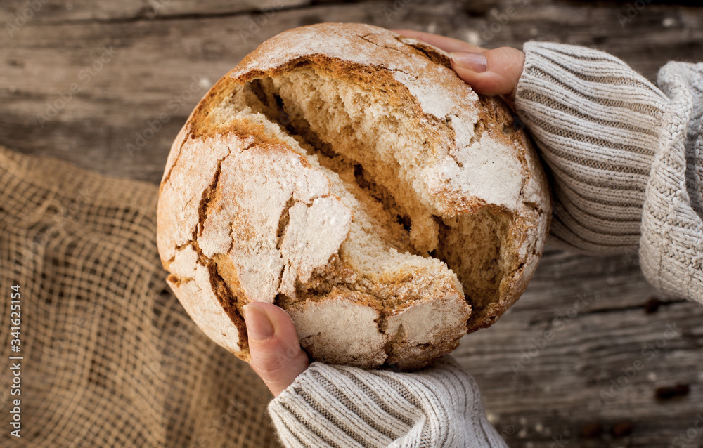 fresh home-made bread. rustic atmosphere. on the background of the old table