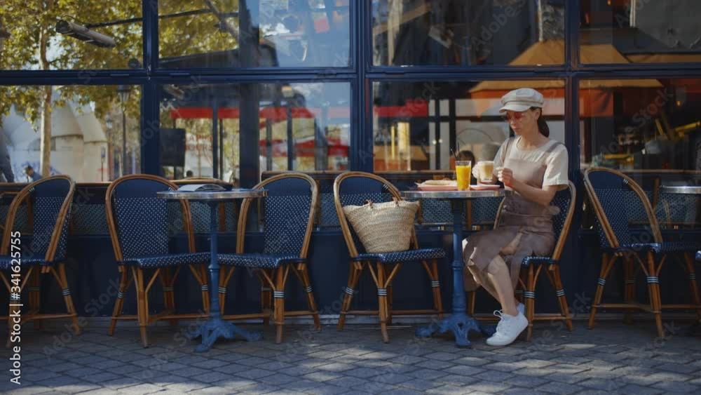 Young girl in a street cafe in Paris