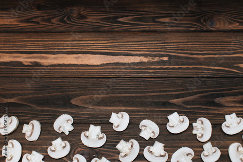 Sliced mushrooms on a wooden background