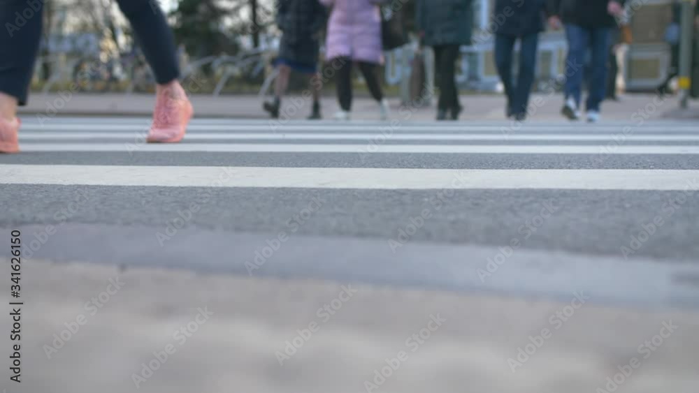 Pedestrians crossing crosswalk after work Pedestrians crossing crosswalk after work