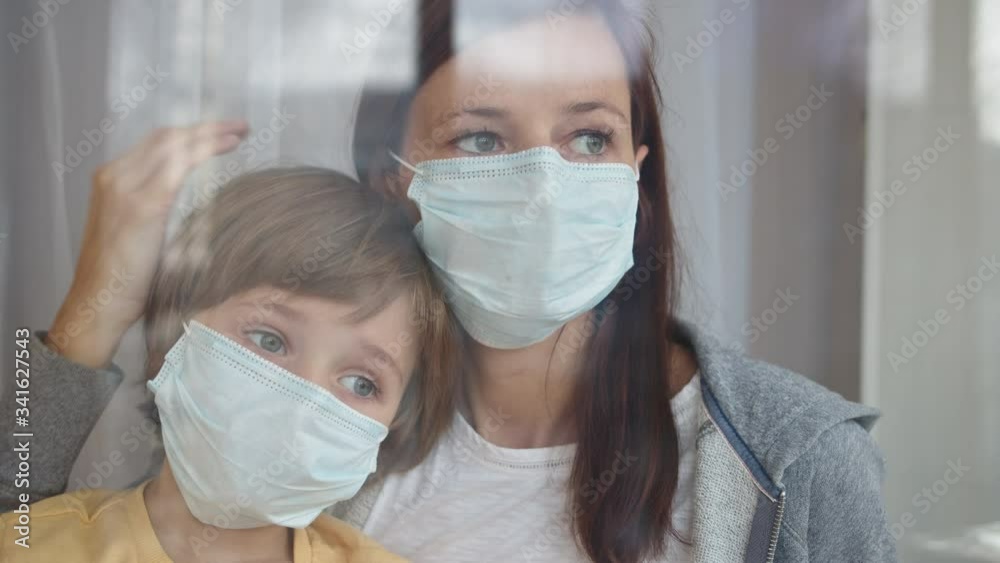 family in protective masks quarantined at home family in protective masks quarantined at home
