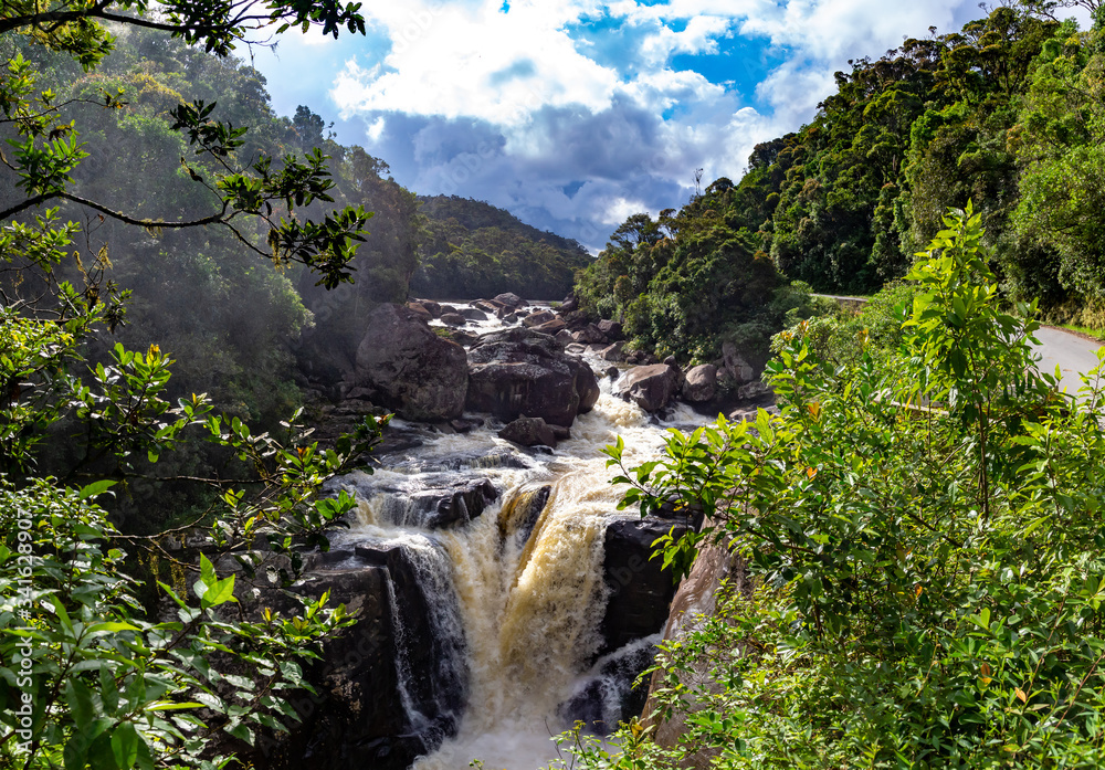 A boiling river with a waterfall in the rainforest - obrazy, fototapety, plakaty 