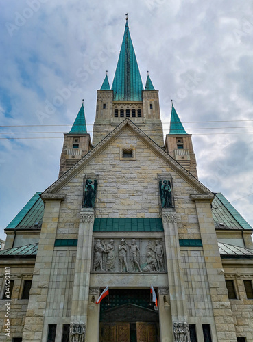 Old white Cathedral building with aquamarine towers in Wroclaw City photo