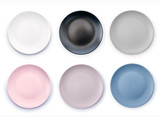 Set of six colorful empty plates isolated on white background top view. White, Black, Grey, Pink, Purple and Navy Blue empty plates collection