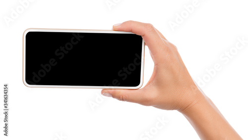 Female hand holding mobile smart phone with blank screen isolated on white background. 