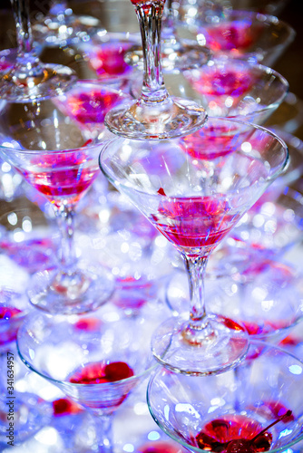 champagne glasses on red