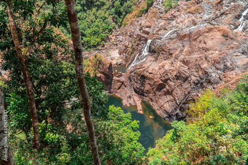 Kuranda Scenic Railway Train. Tourist train journey across waterfalls, rainforest and jungles in Cairns Australia. View of beautfiul Stoney Creek Falls. Slow Motion.