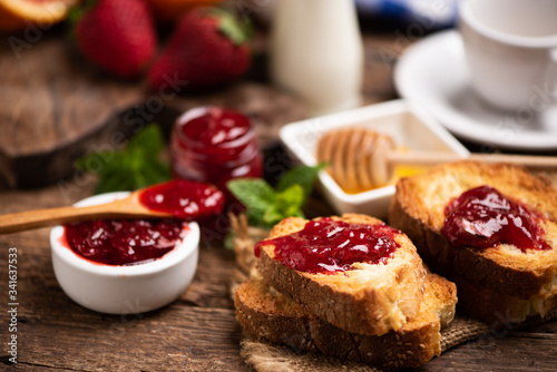 Fresh strawberry jam with bread for breakfast