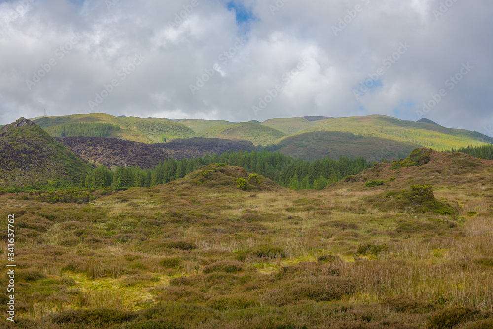 Fields with blue sky and clouds near gruta do Natal in municipality of Praia da Vitoria, on the island of Terceira