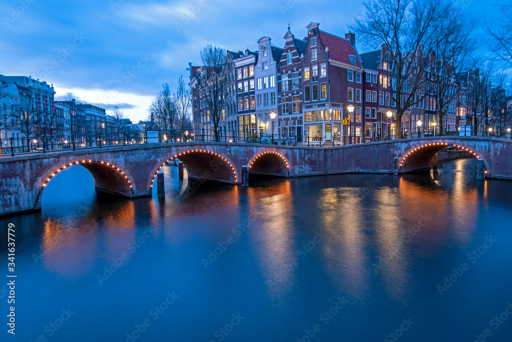 Fototapeta premium City scenic from Amsterdam in the Netherlands at sunset