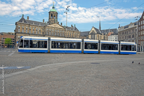 City scenic from Amsterdam at the Dam Square with the Royal Palace in the Netherlands