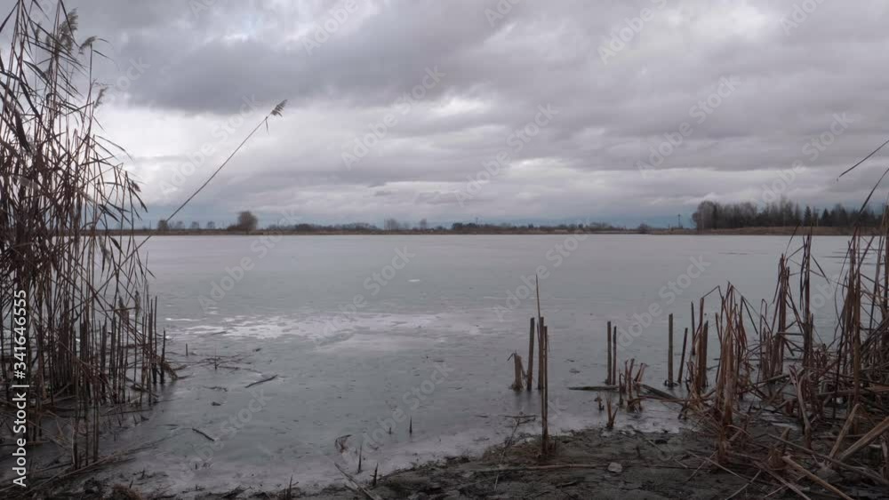 A shot from the shore of a frozen lake. A shot from the shore of a frozen lake.