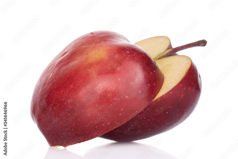 Group of two halves of sliced red delicious apple isolated on white