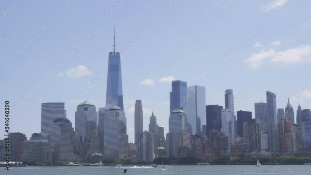 Fast tight pan of downtown Manhattan skyline to Hudson Yards on the water from Liberty State Park Fast tight pan of downtown Manhattan skyline to Hudson Yards on the water from Liberty State Park