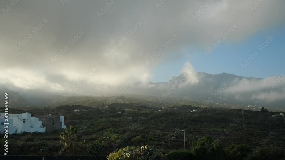 Dark low clouds over the mountains of Tenerife at twilight, Part two Dark low clouds over the mountains of Tenerife at twilight, Part two