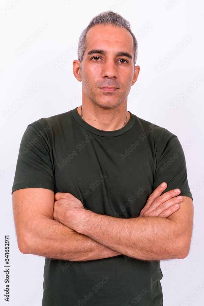 Portrait of handsome Persian man with arms crossed Portrait of handsome Persian man with arms crossed