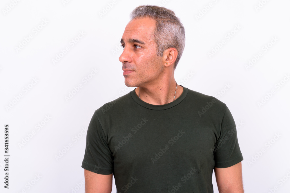 Profile view of handsome Persian man looking away Profile view of handsome Persian man looking away