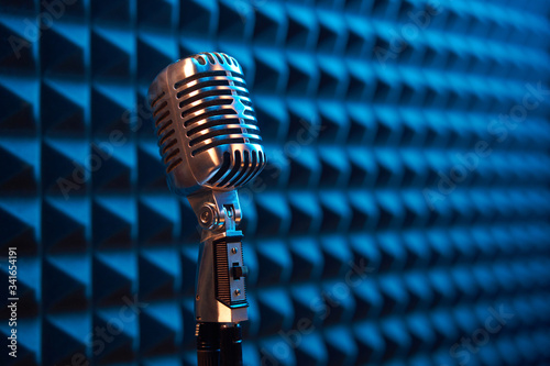 Studio retro condenser microphone on acoustic foam panel