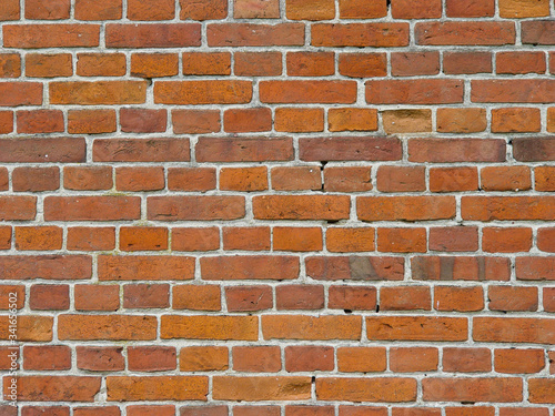 Brick wall of red brick in an old house.