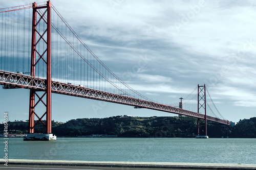 25th of April Bridge over the Tagus river, connecting Almada and Lisbon in Portugal © Natallia